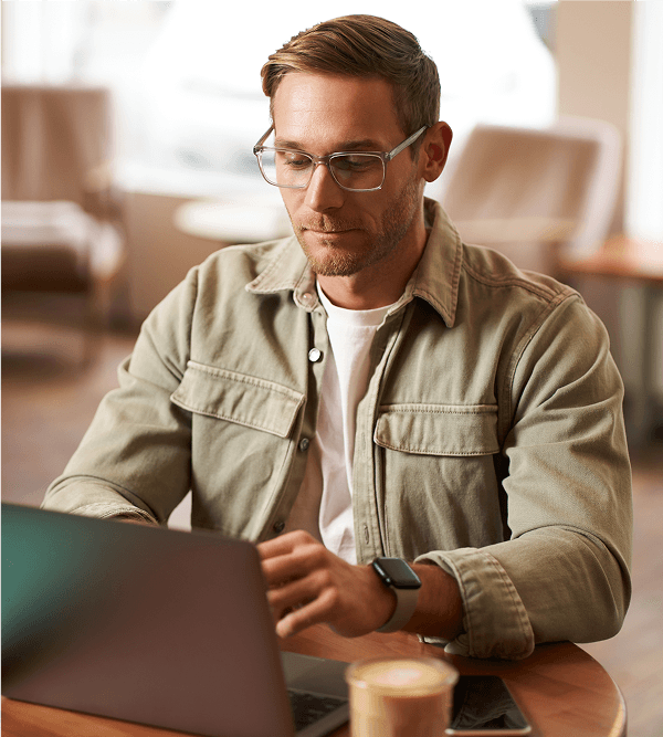 Man using a laptop at a desk